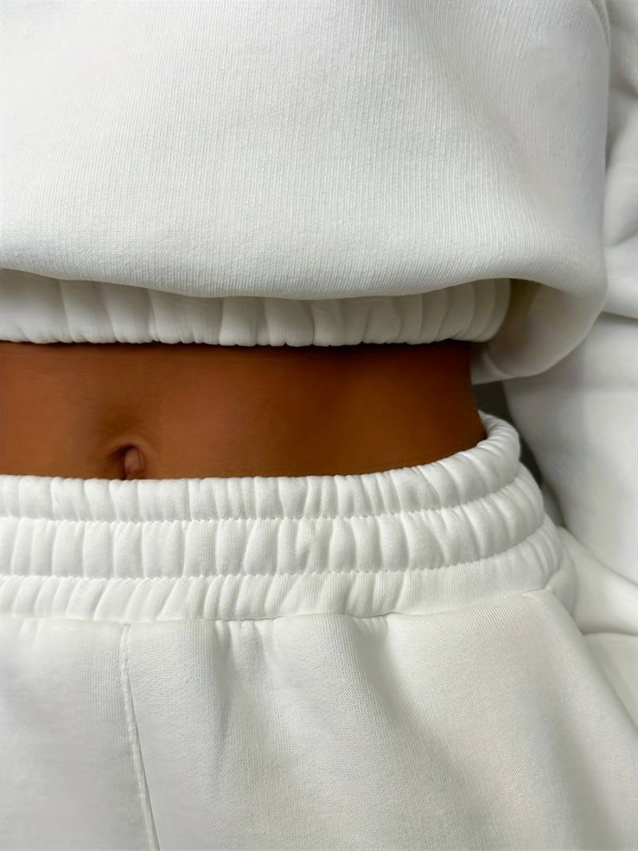 Blus med dragkedja och träningsoverallsbyxa