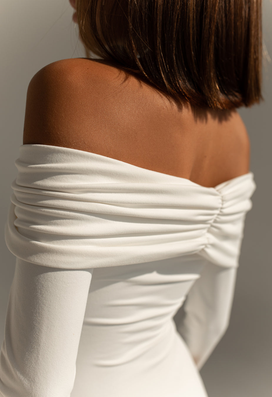 Witte Off-Shoulder Bodysuit met Lange Mouwen