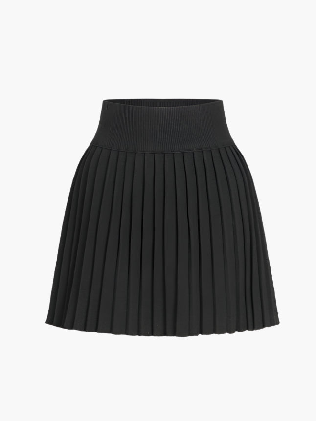 Set van geribbeld vest en geplooide rok