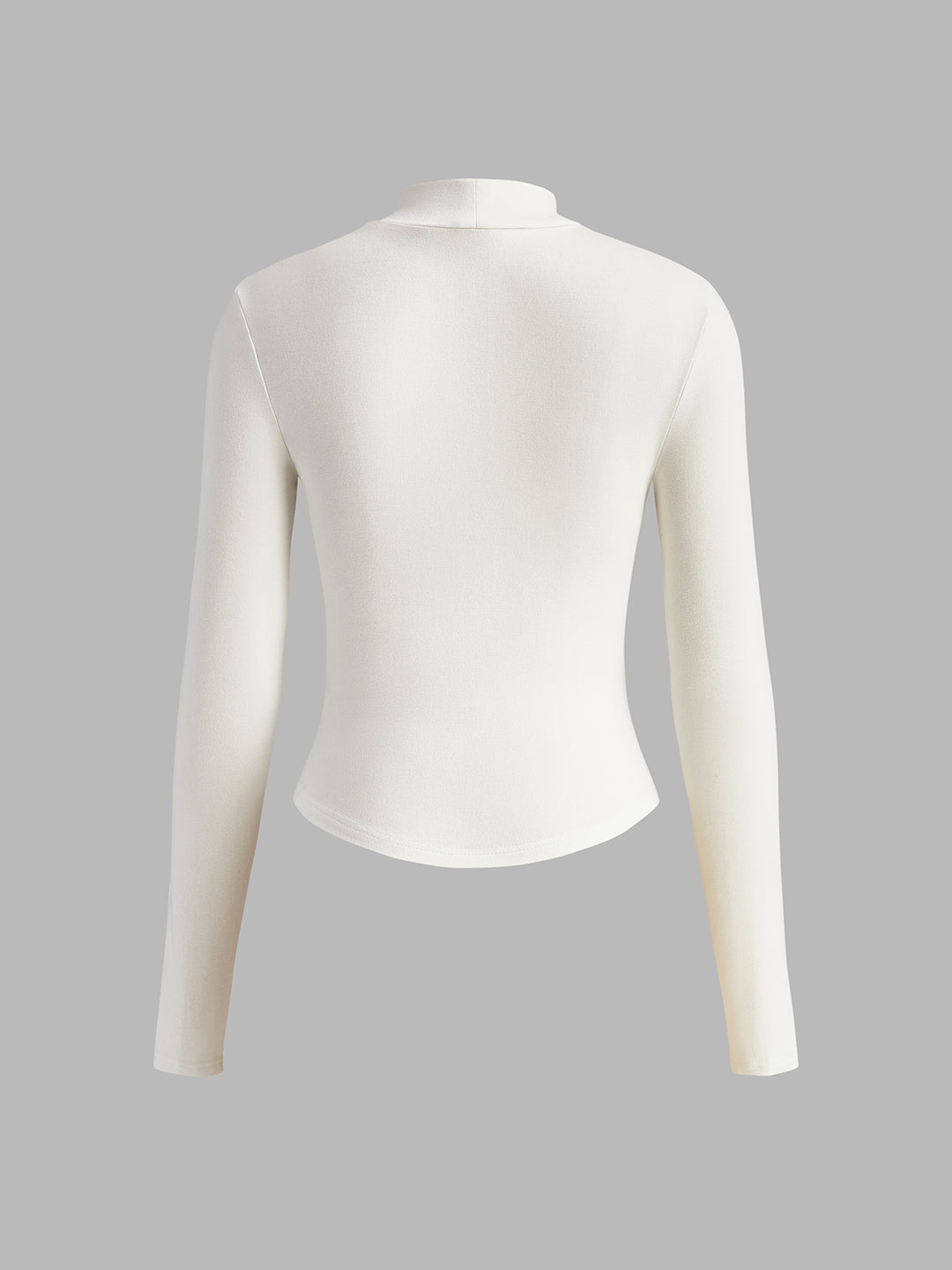 Witte getailleerde top met lange mouwen en korsetdetails