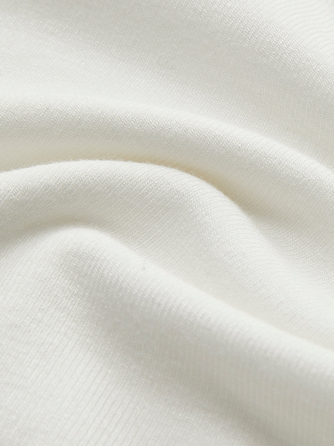 Witte getailleerde top met lange mouwen en korsetdetails