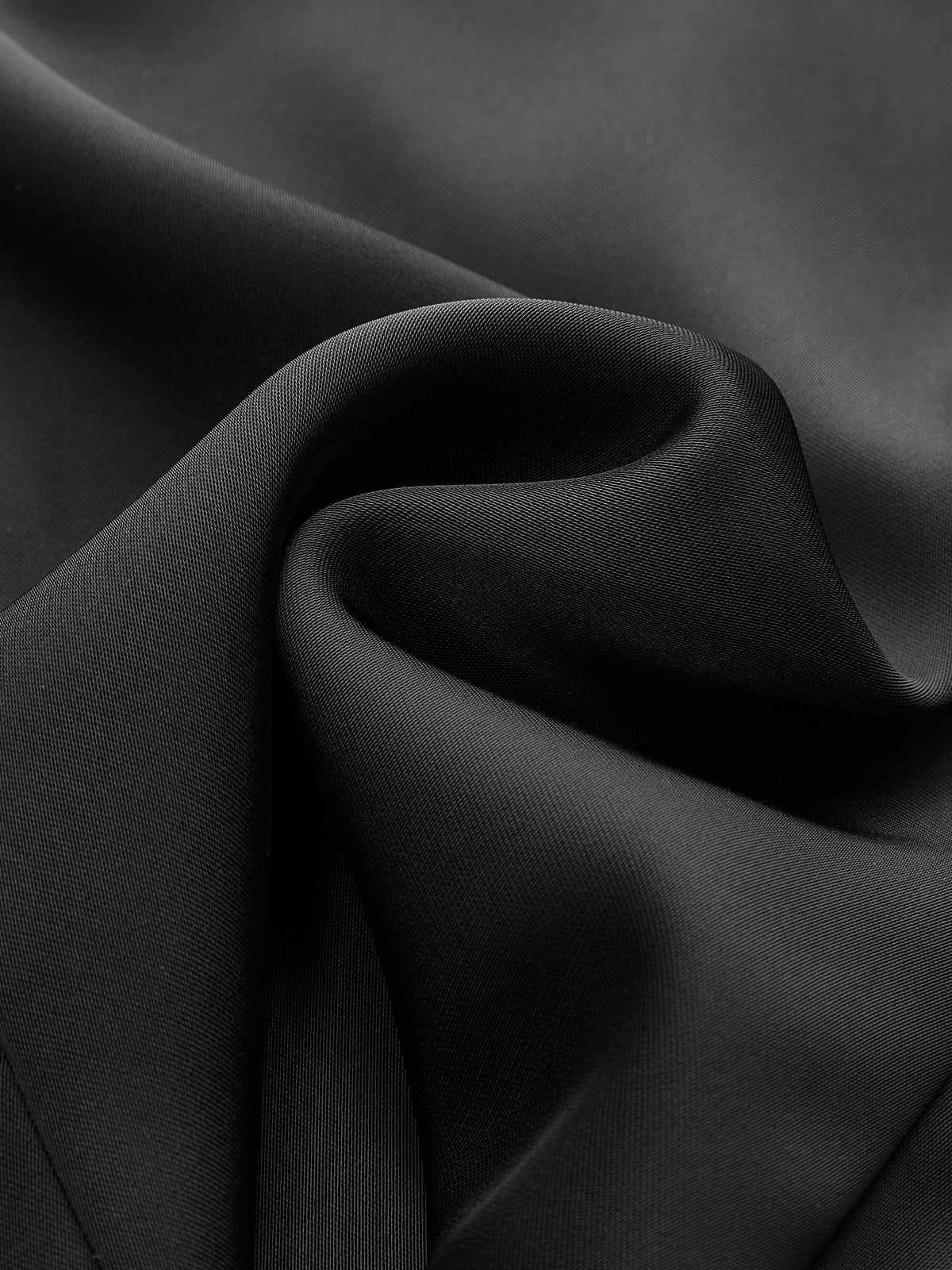 Gevormde top met knoopdetails