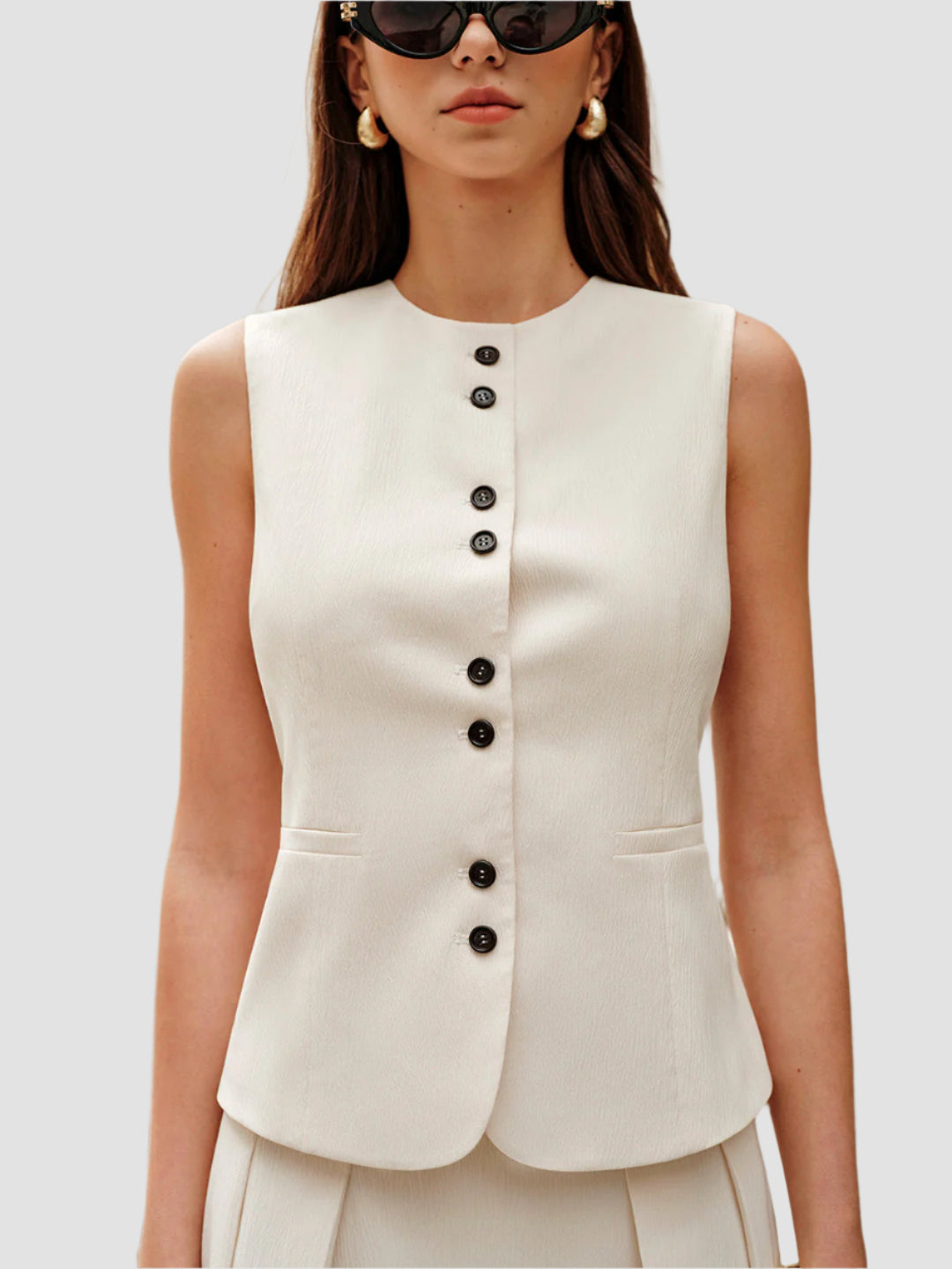 Crèmekleurige vest en minirokset