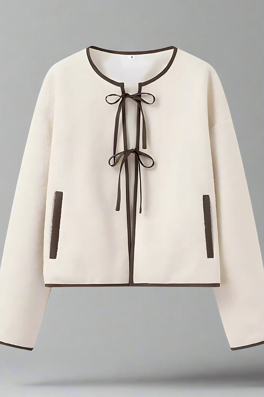 BEIGE VEST MET STRIKSLUITING