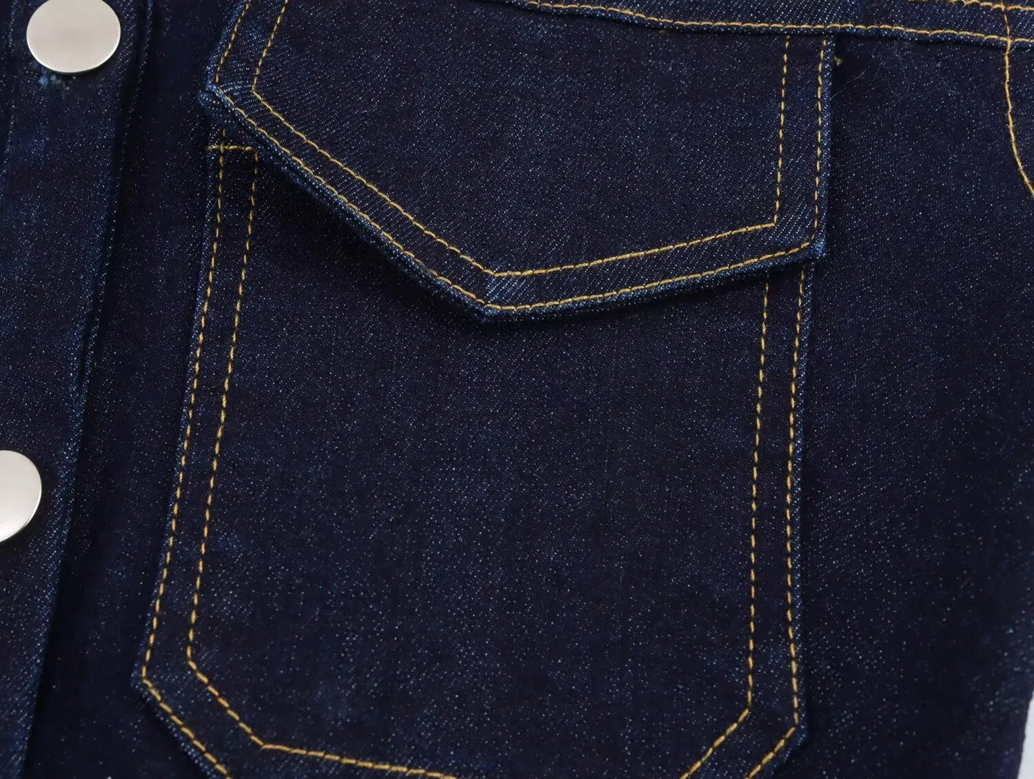 Mouwloze denimjurk met knopen