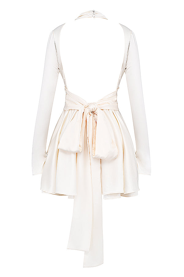 Beige miniklänning med rosett baktill