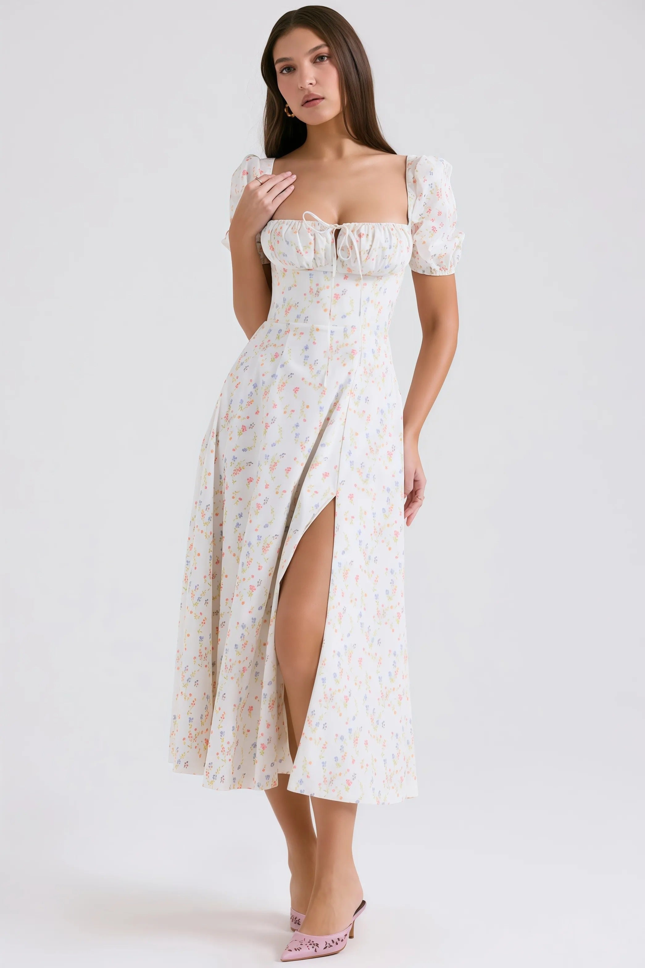 Witte midi-jurk met pastelkleurig bloemenpatroon en pofmouwen