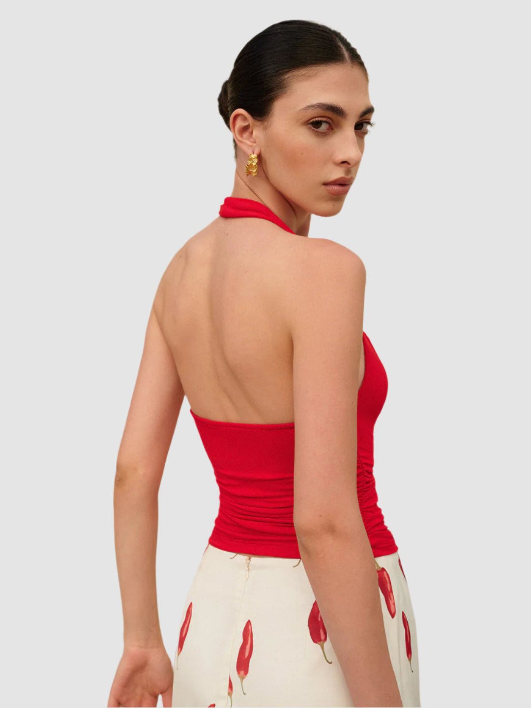 Rode haltertop met V-hals en geplooide taille