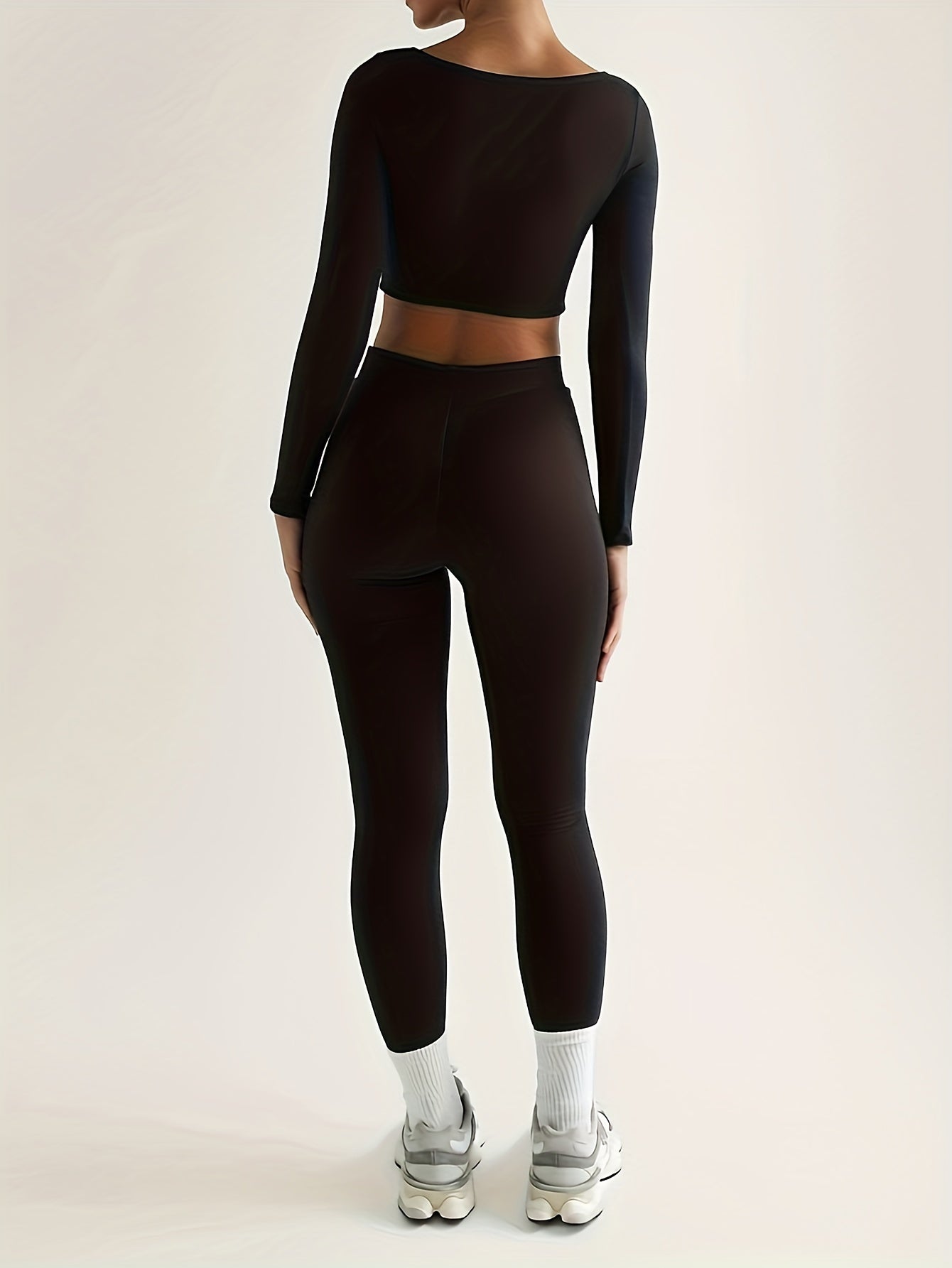 Trainingspakset met lange mouwen, top en legging